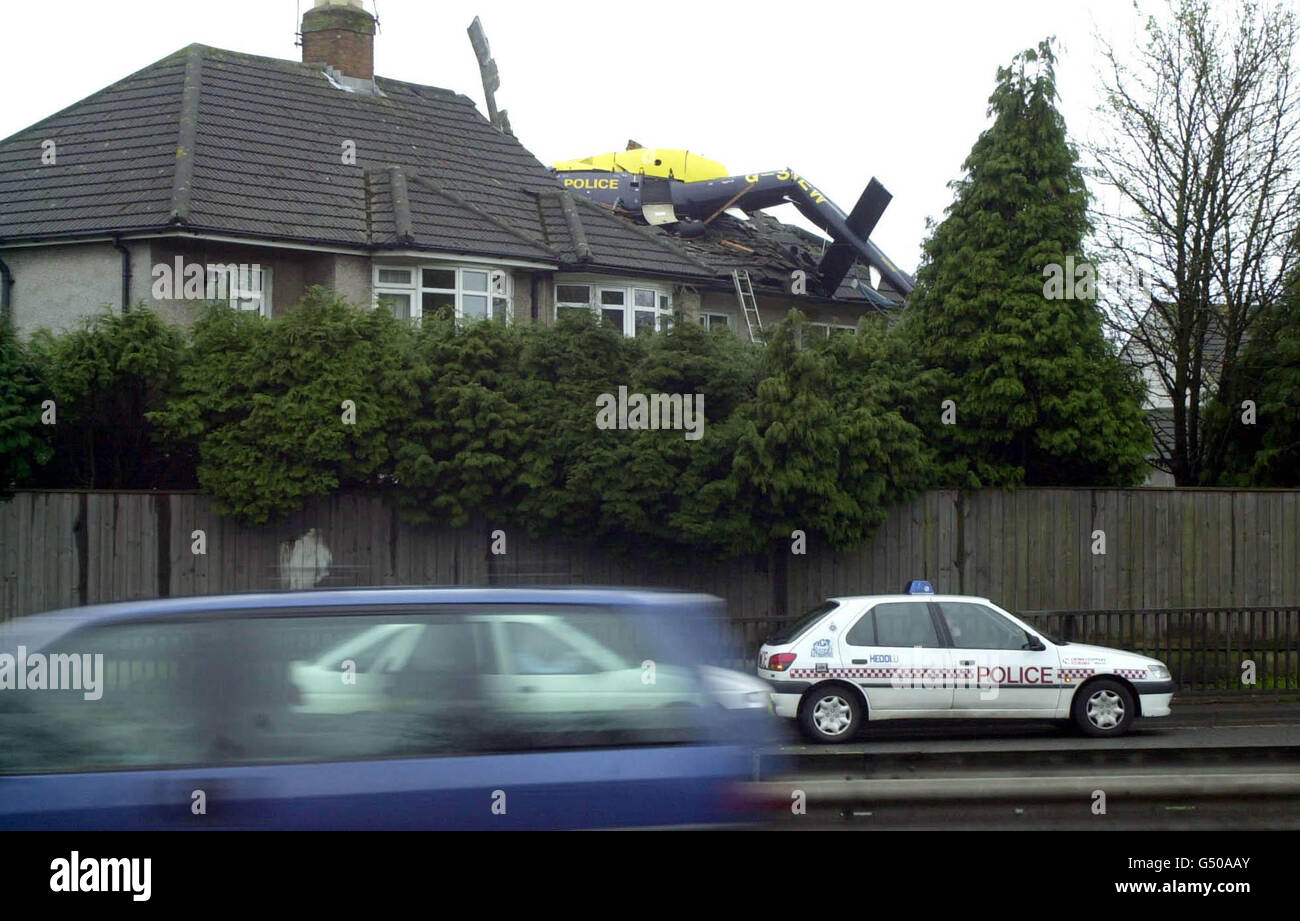 The Wreckage Of A Police Helicopter On The Roof Of A House After The